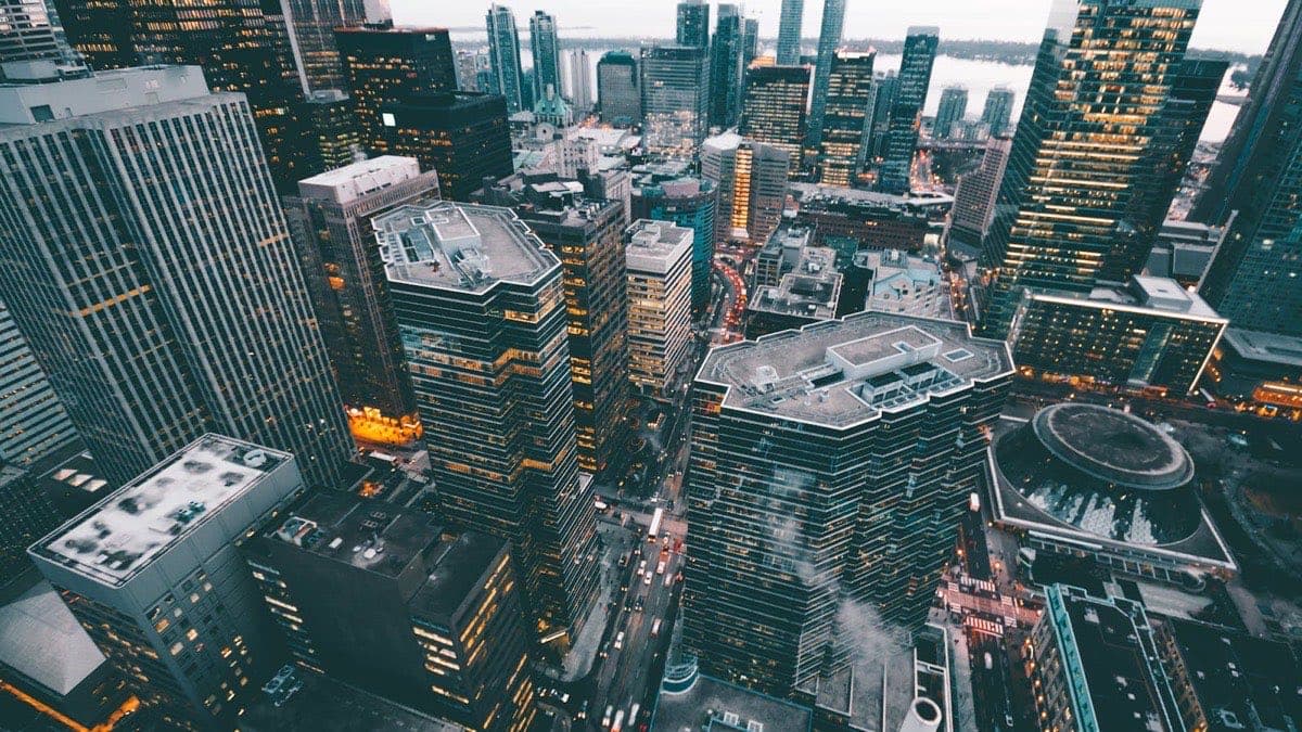 Aerial view of commercial city buildings at dusk