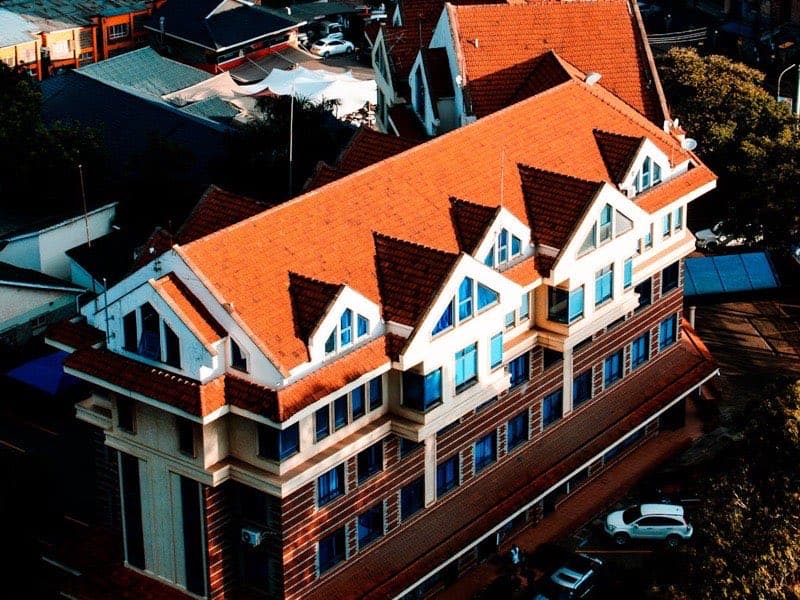 Aerial view of commercial building with flat roof drainage system