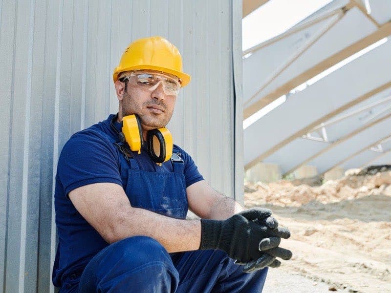 Professional construction worker with protective equipment